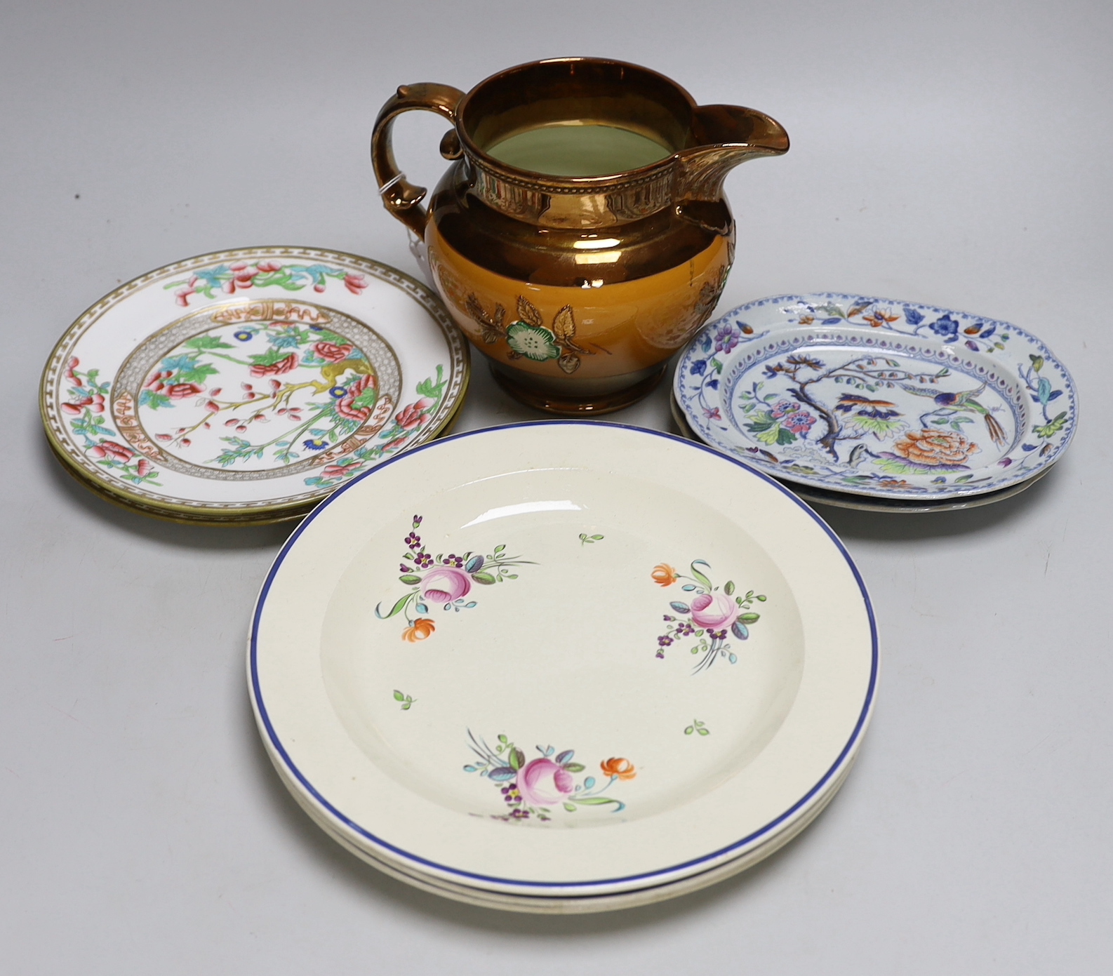 Late 18th/early 19th century: Four creamware plates painted with roses and other flowers, two Davenport small imari pattern plates, two other plates and a copper lustre jug, the largest 25cm in diameter